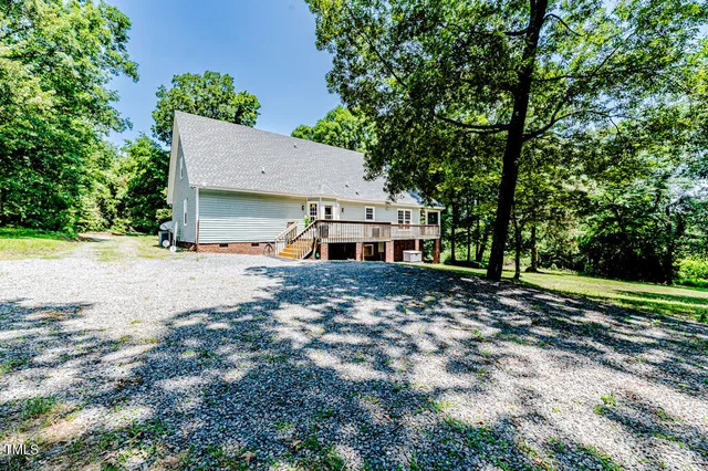 a bathroom with a shower and a glass door