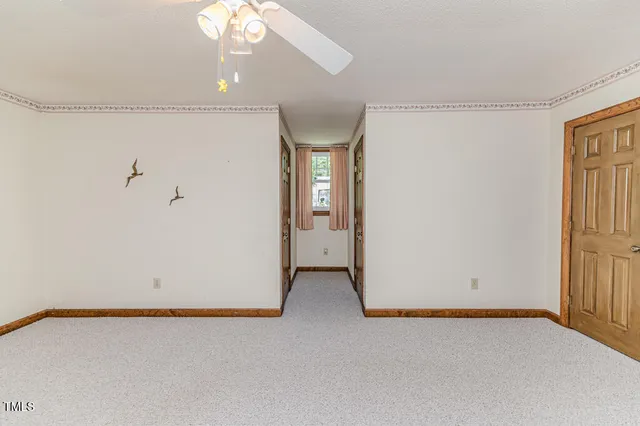 a view of hall way with furniture and staircase