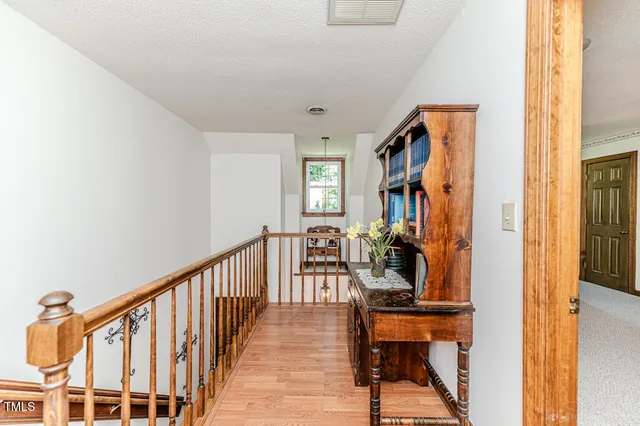 a view of a house with a yard porch and sitting area