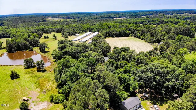 a swimming pool with outdoor seating and yard