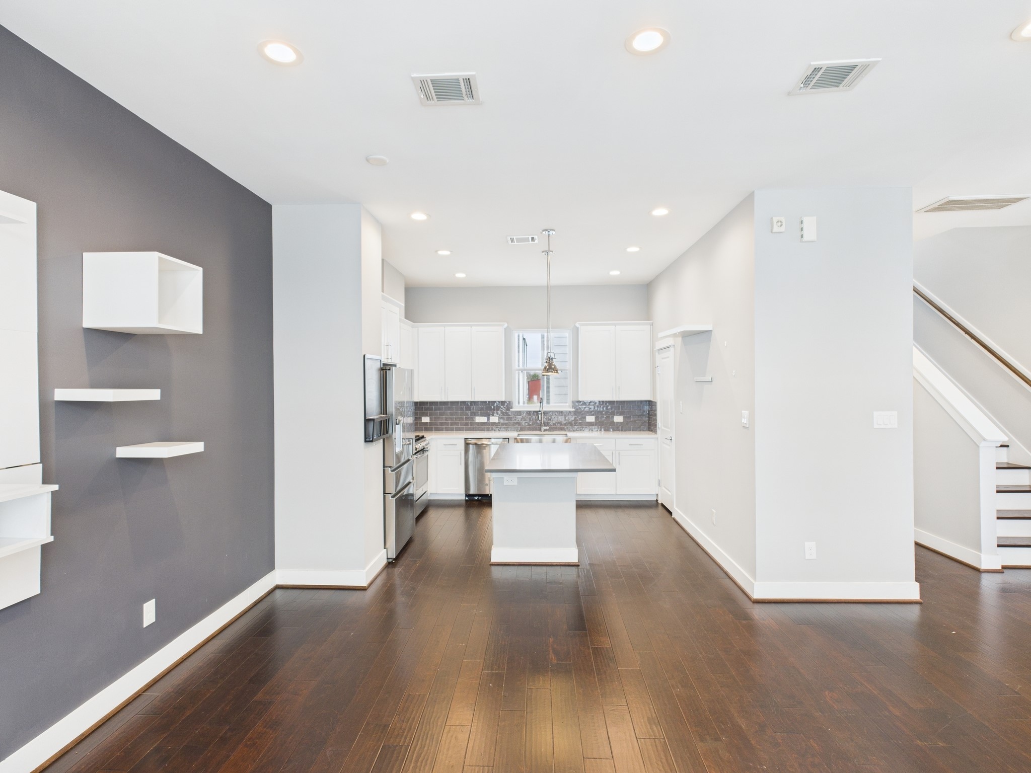 754 West Donovan Street Houston, TX 77091 - Photo 11 of 31 a view of kitchen with kitchen island stainless steel appliances refrigerator stove microwave and cabinets
