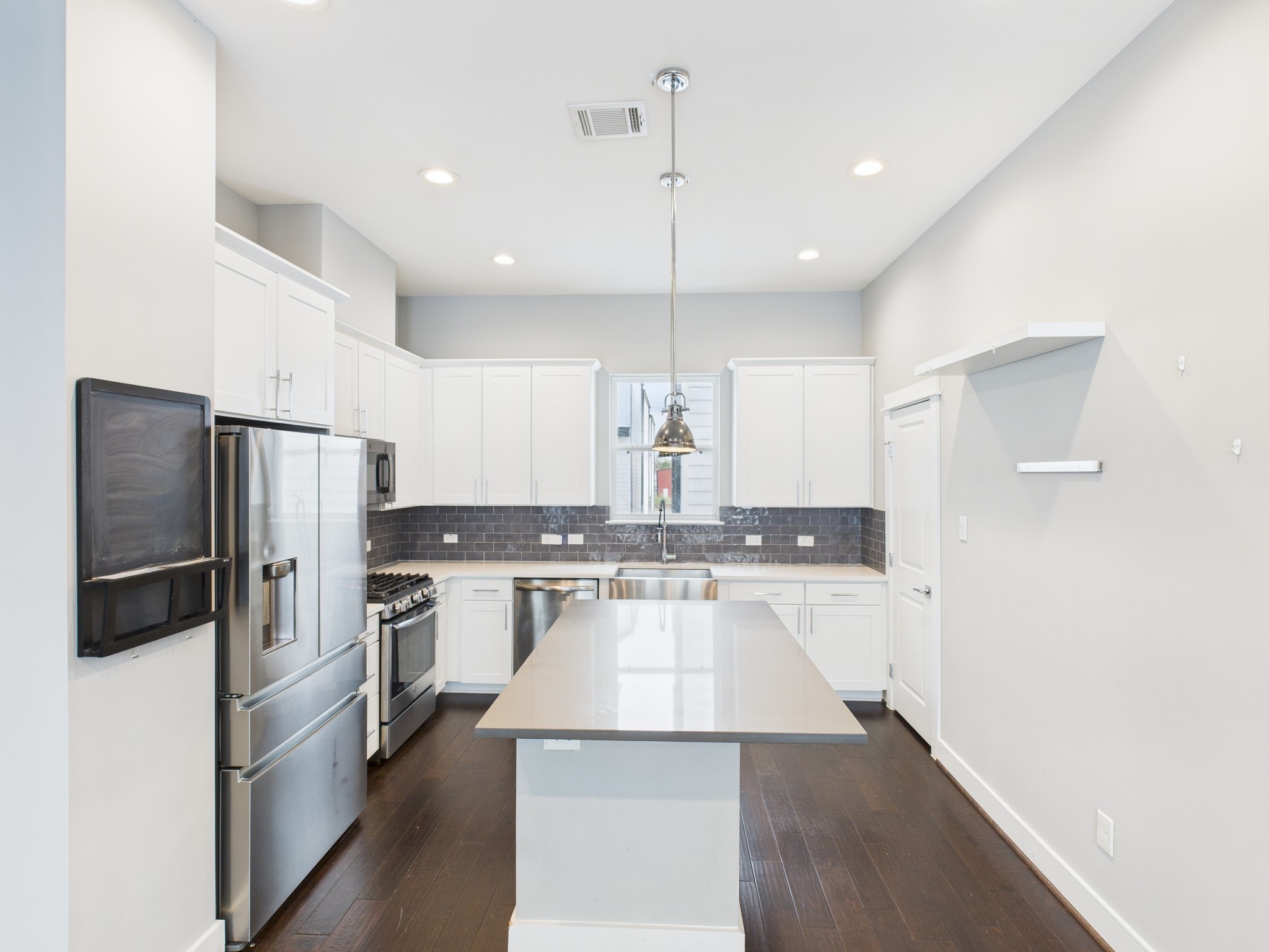 754 West Donovan Street Houston, TX 77091 - Photo 12 of 31 a kitchen with a refrigerator a sink and a oven
