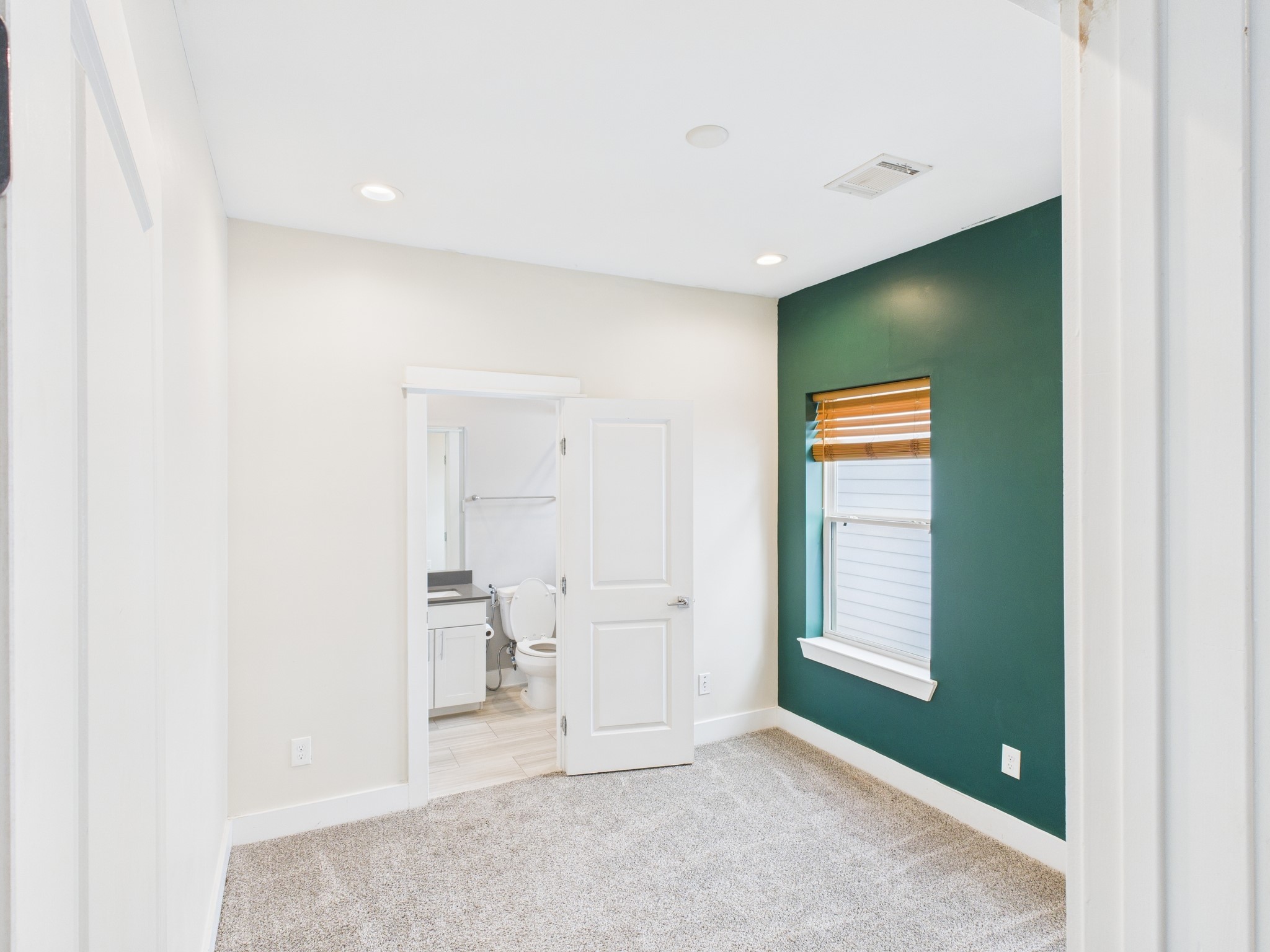 754 West Donovan Street Houston, TX 77091 - Photo 18 of 31 a view of an empty room with a bathroom and a window