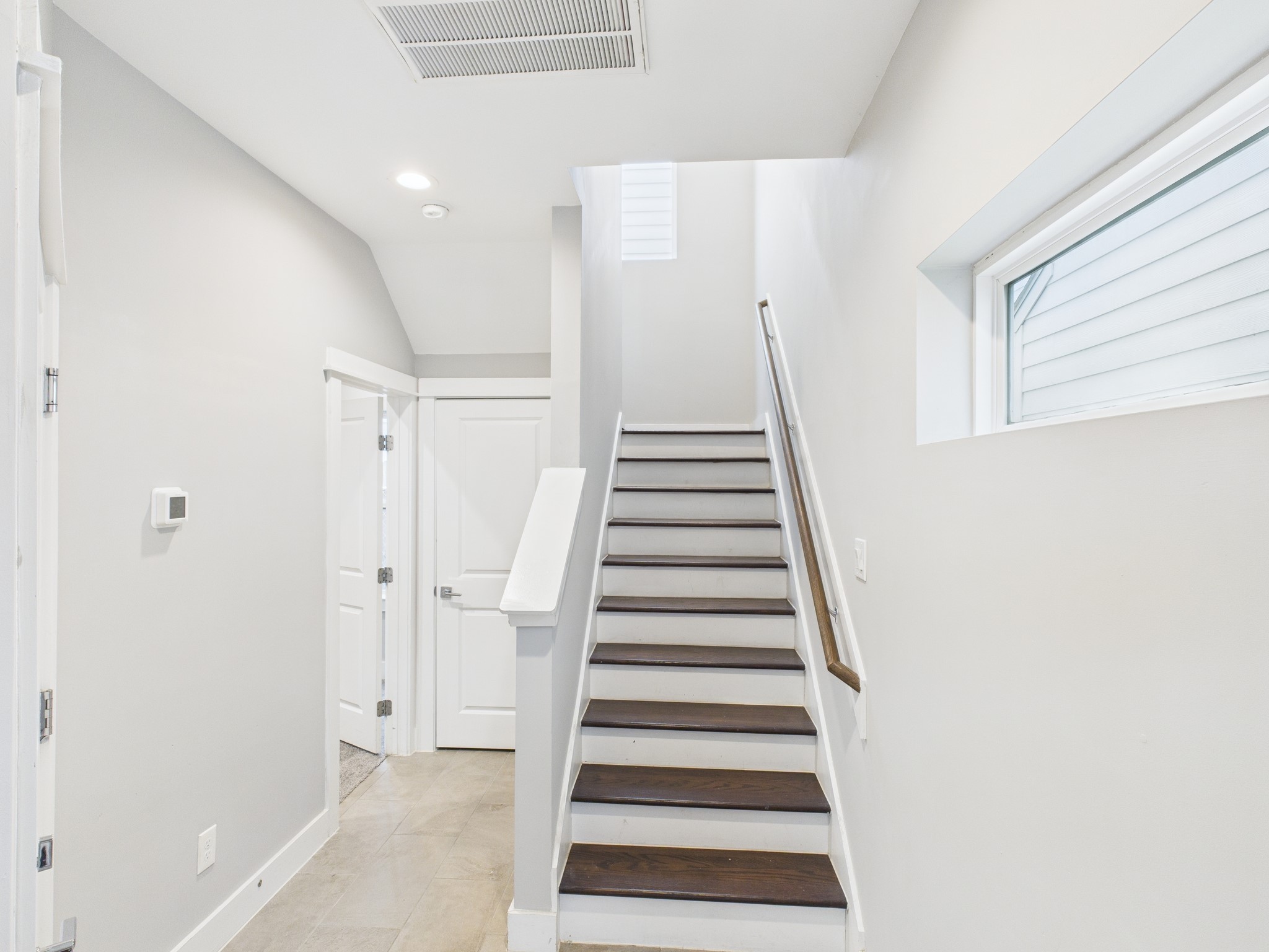 754 West Donovan Street Houston, TX 77091 - Photo 4 of 31 a view of entryway with wooden floor and white walls