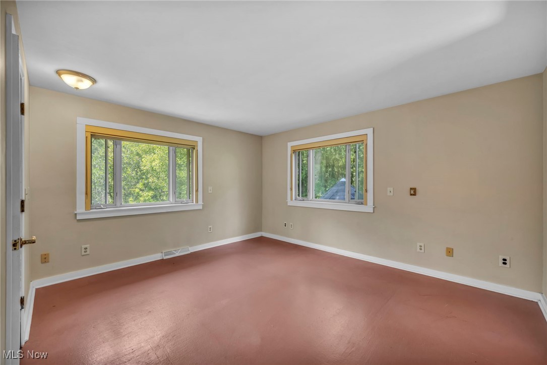 10982 Root Road Columbia Station, OH 44028 - Photo 20 of 49 Spare room featuring baseboards and finished concrete flooring