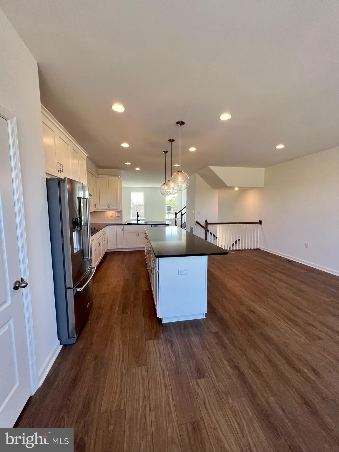 3141 Eton Place Winchester, VA 22601 - Photo 16 of 41 a living room with stainless steel appliances furniture wooden floor and a view of kitchen