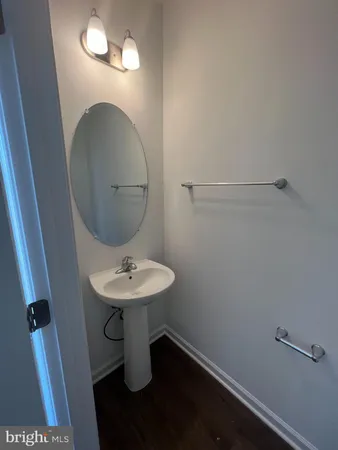 a kitchen with a sink a counter and cabinets