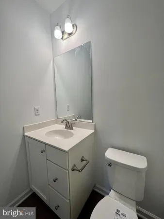 a bathroom with a toilet a sink and bathtub