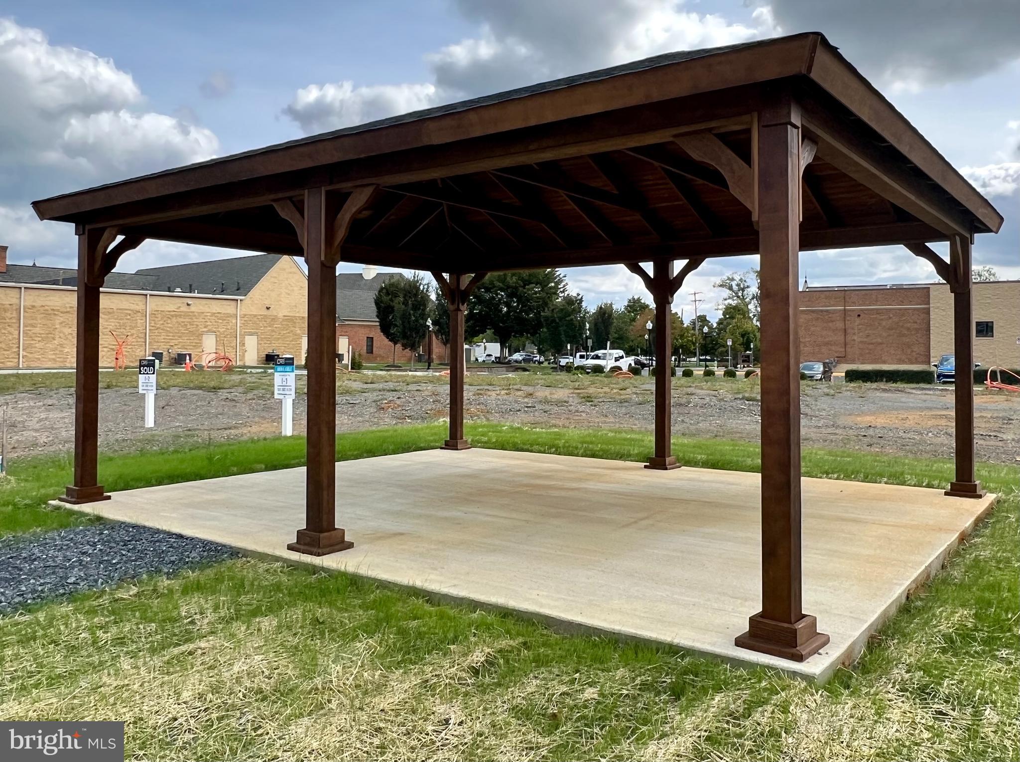 3141 Eton Place Winchester, VA 22601 - Photo 41 of 41 a view of a backyard with a table and chairs under an umbrella