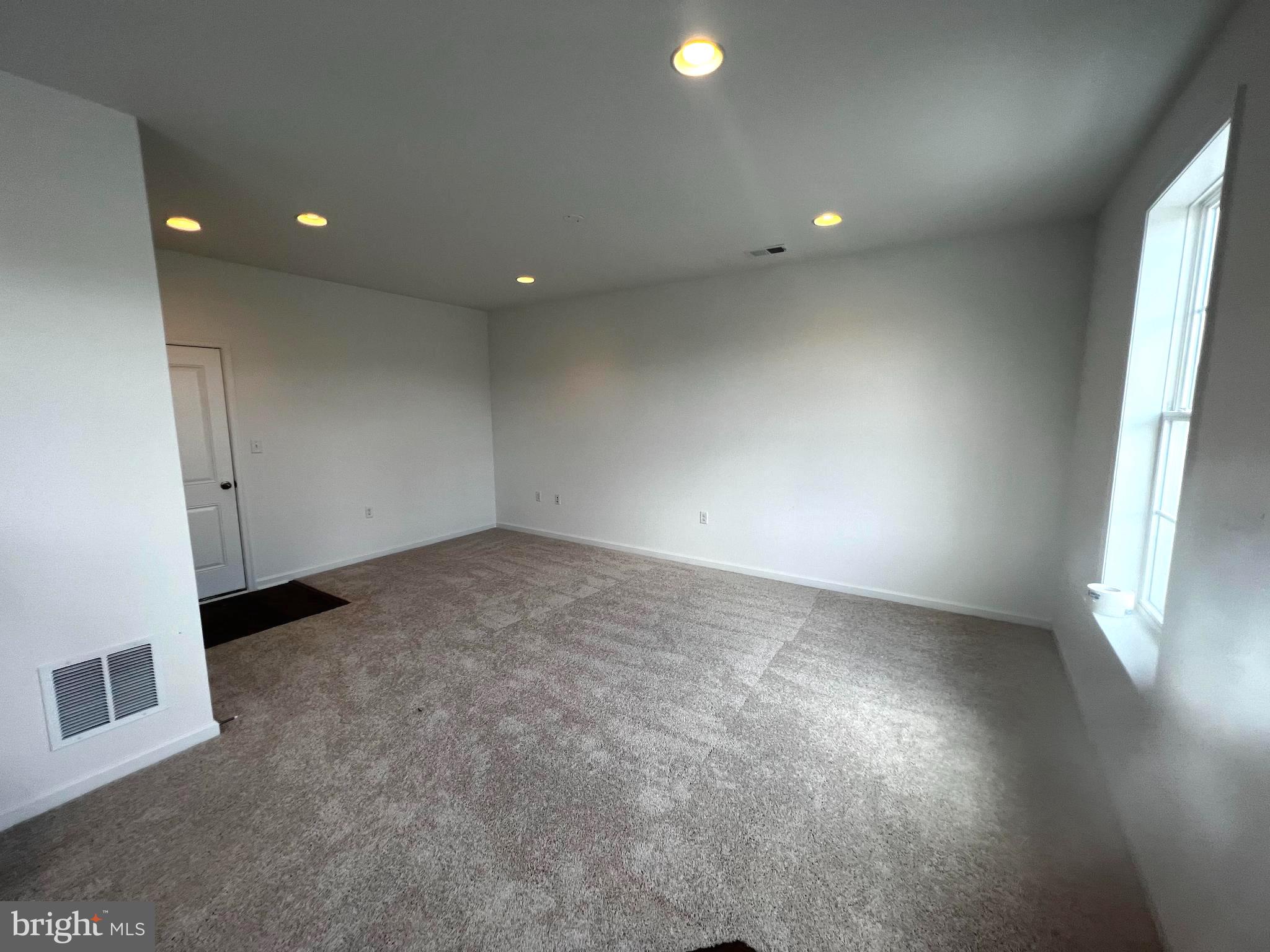 3141 Eton Place Winchester, VA 22601 - Photo 5 of 41 an empty room with wooden floor and windows