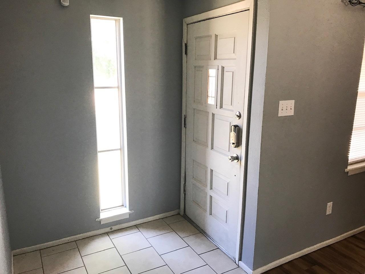 3520 Bangor Drive Lubbock, TX 79407 - Photo 4 of 11 an empty room with windows and closet
