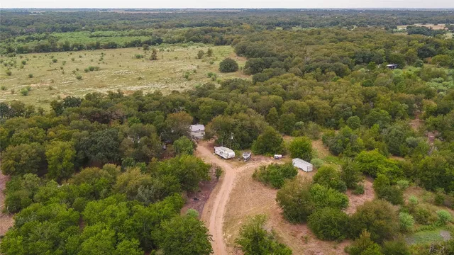 an aerial view of houses with yard