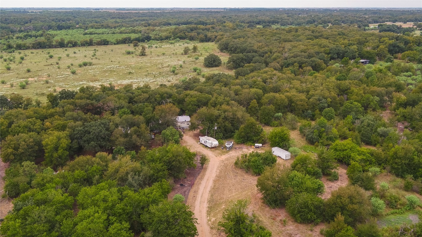 an aerial view of houses with yard