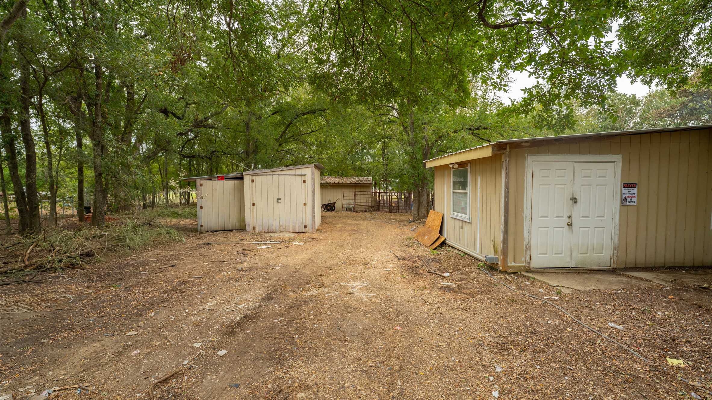 2348 County Road 404 Loop Bartlett, TX 76511 - Photo 35 of 40 View of yard featuring a storage shed and view of wooded area