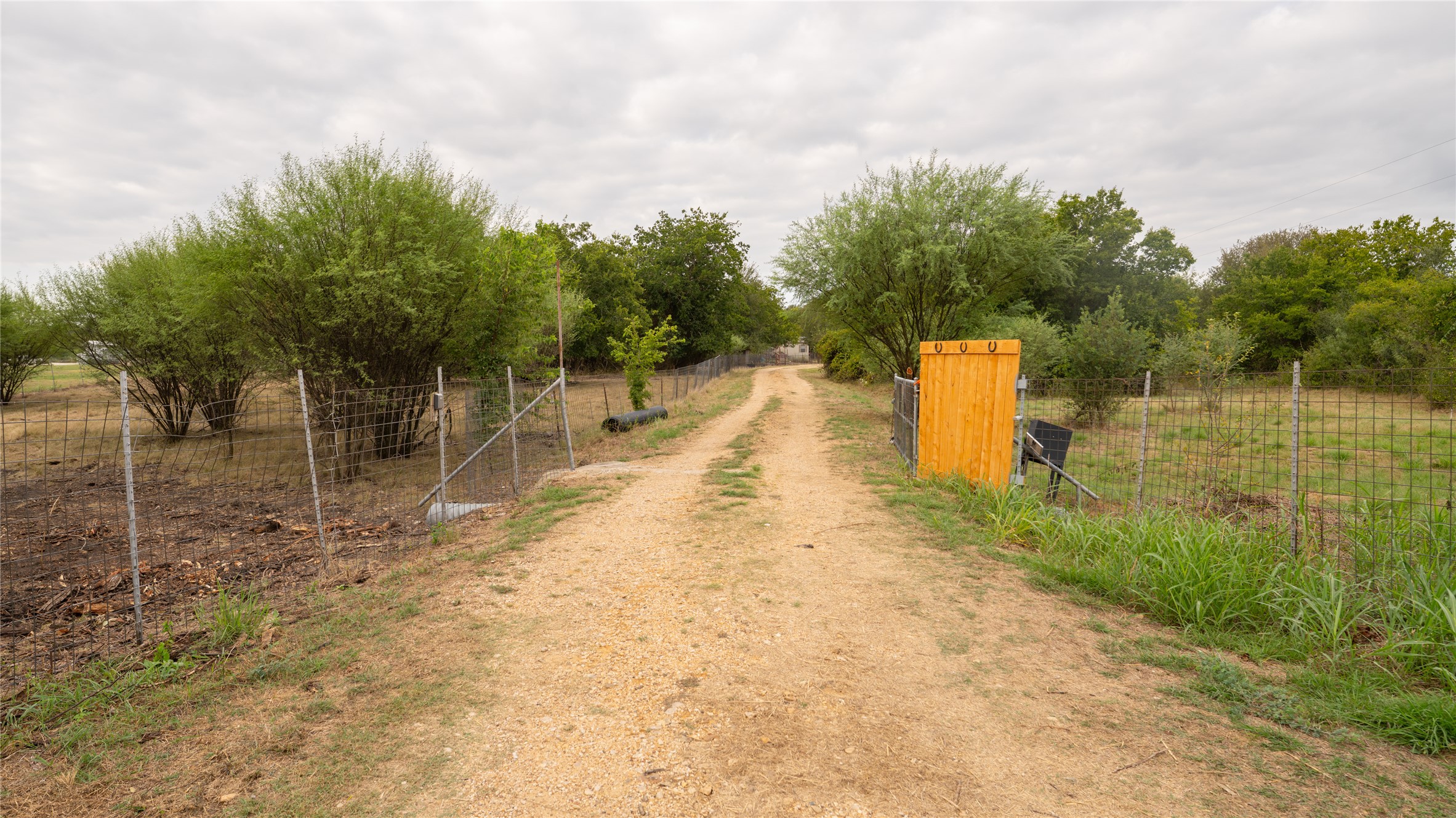 2348 County Road 404 Loop Bartlett, TX 76511 - Photo 6 of 40 View of dirt / gravel road with a view of rural / pastoral area