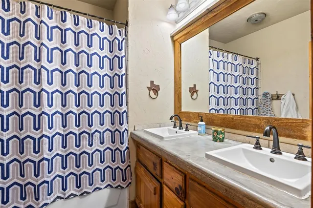 a bathroom with a sink a vanity and a mirror
