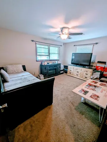 a bedroom with a bed and window