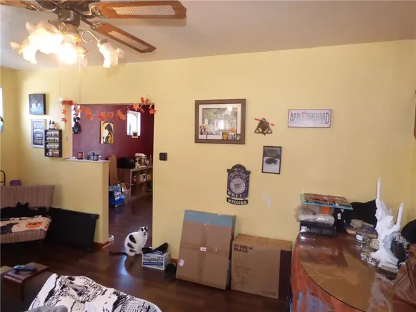 a view of workspace with lounge chair and wooden floor