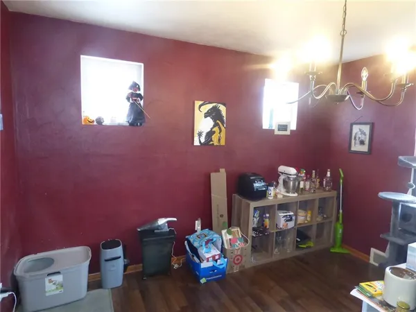 a bedroom with furniture and a lamp