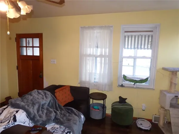 a bedroom with bed and a window