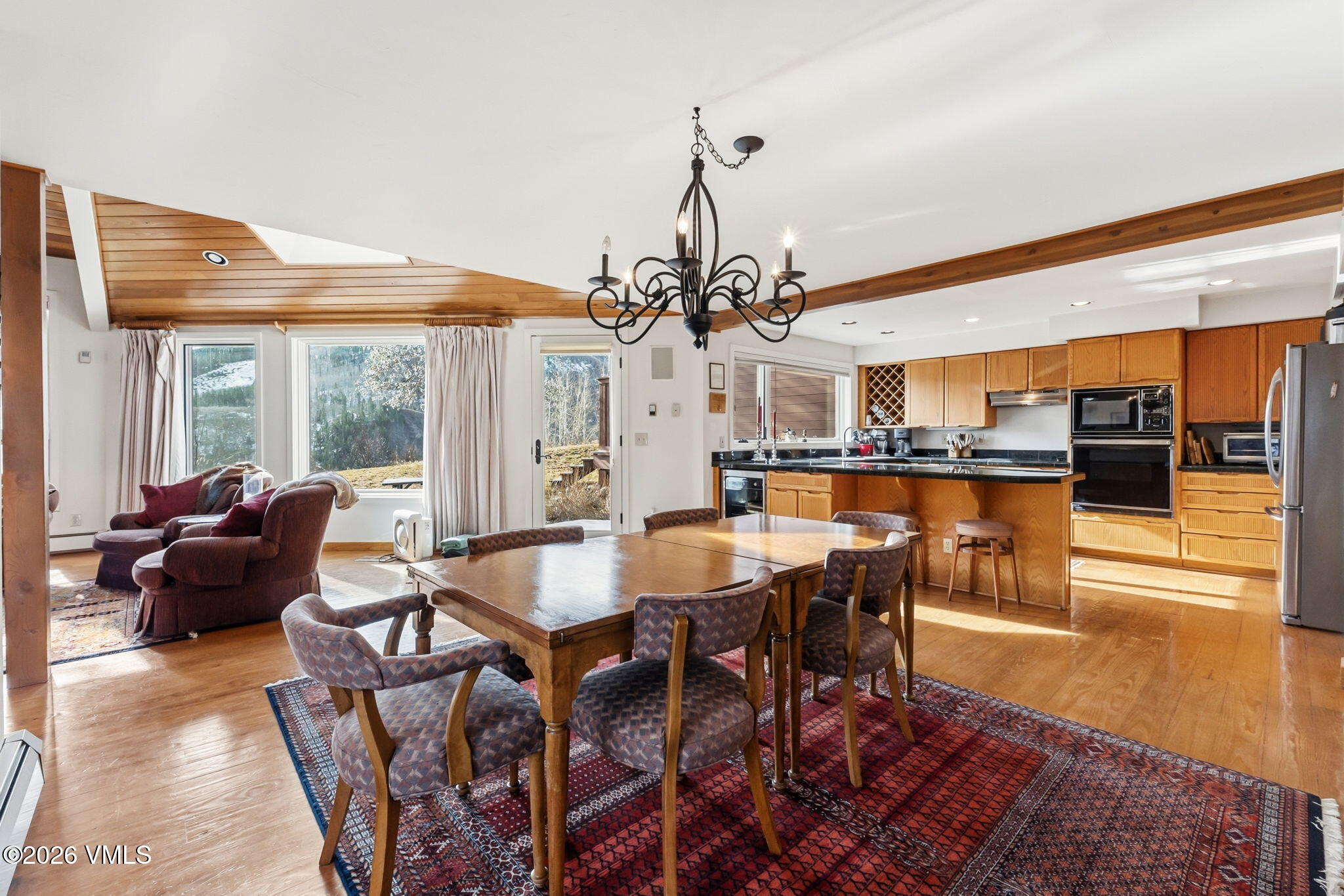 a view of a dining room with furniture window and outside view