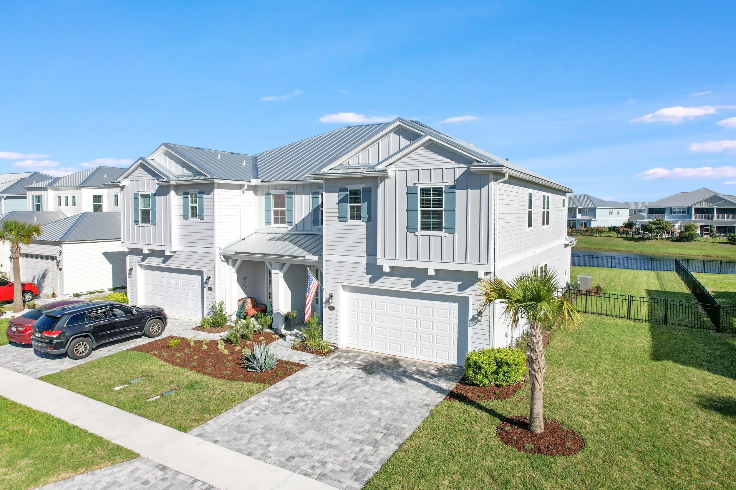 404 Rum Runner Way St. Johns, FL 32259 - Photo 1 of 41 a front view of a house with garden