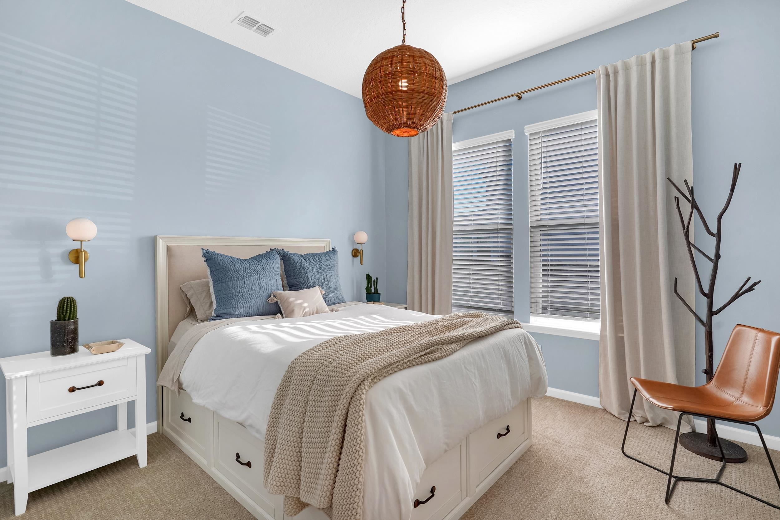 404 Rum Runner Way St. Johns, FL 32259 - Photo 11 of 41 a bedroom with a bed a chair and a large window
