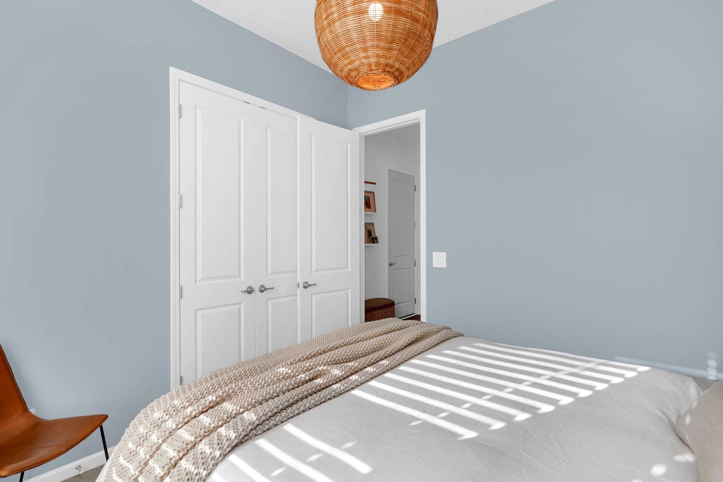 404 Rum Runner Way St. Johns, FL 32259 - Photo 12 of 41 a bedroom with a bed and a painting on the wall
