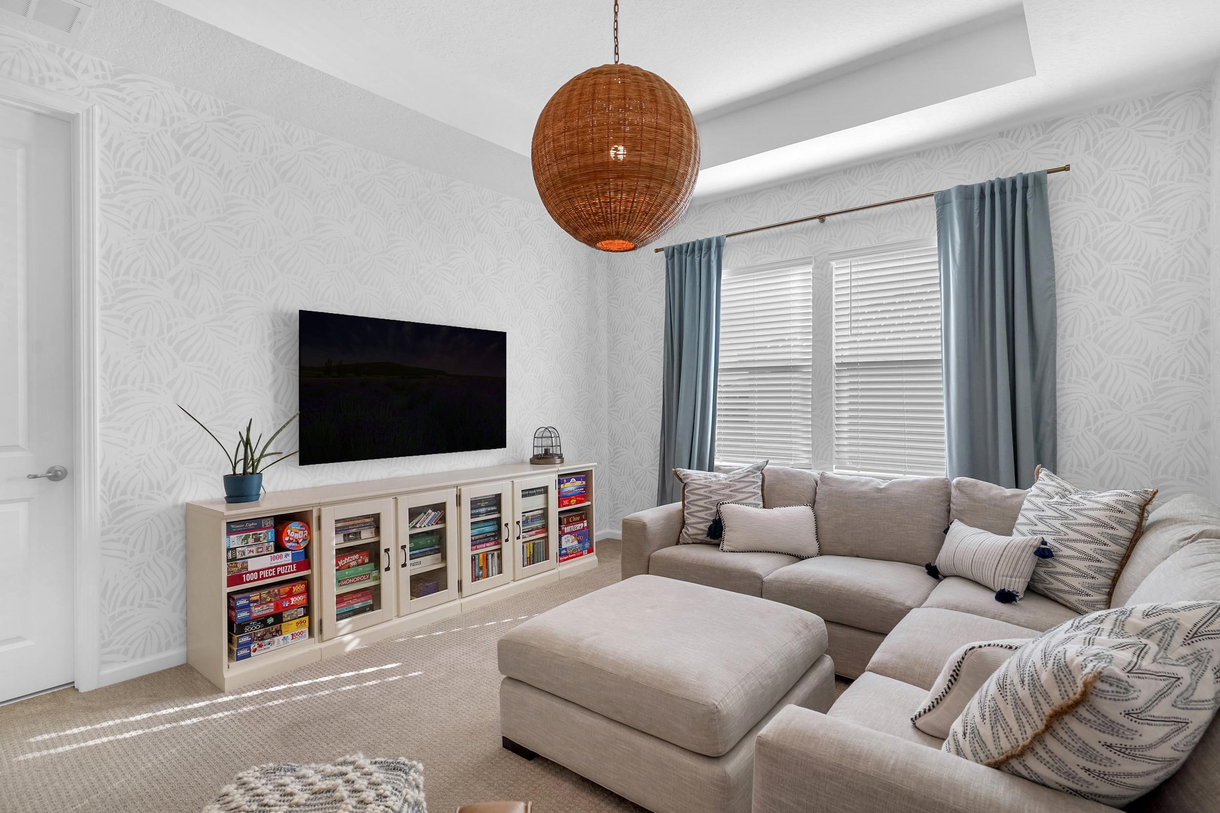 404 Rum Runner Way St. Johns, FL 32259 - Photo 22 of 41 a living room with furniture and a flat screen tv