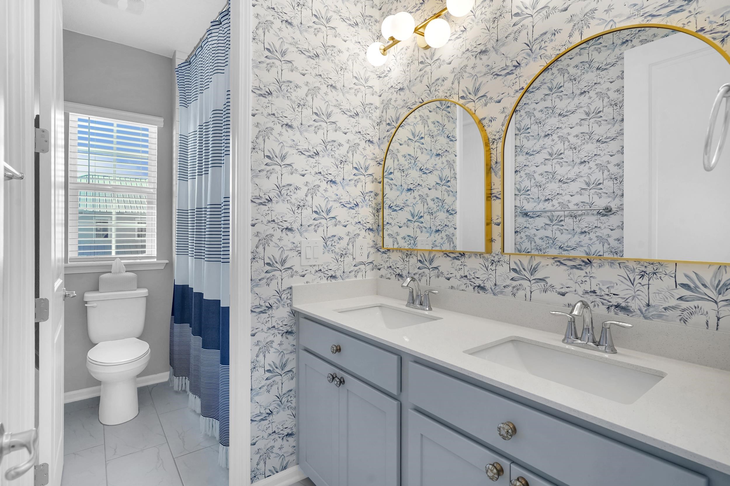 404 Rum Runner Way St. Johns, FL 32259 - Photo 23 of 41 a bathroom with a sink a toilet and a mirror