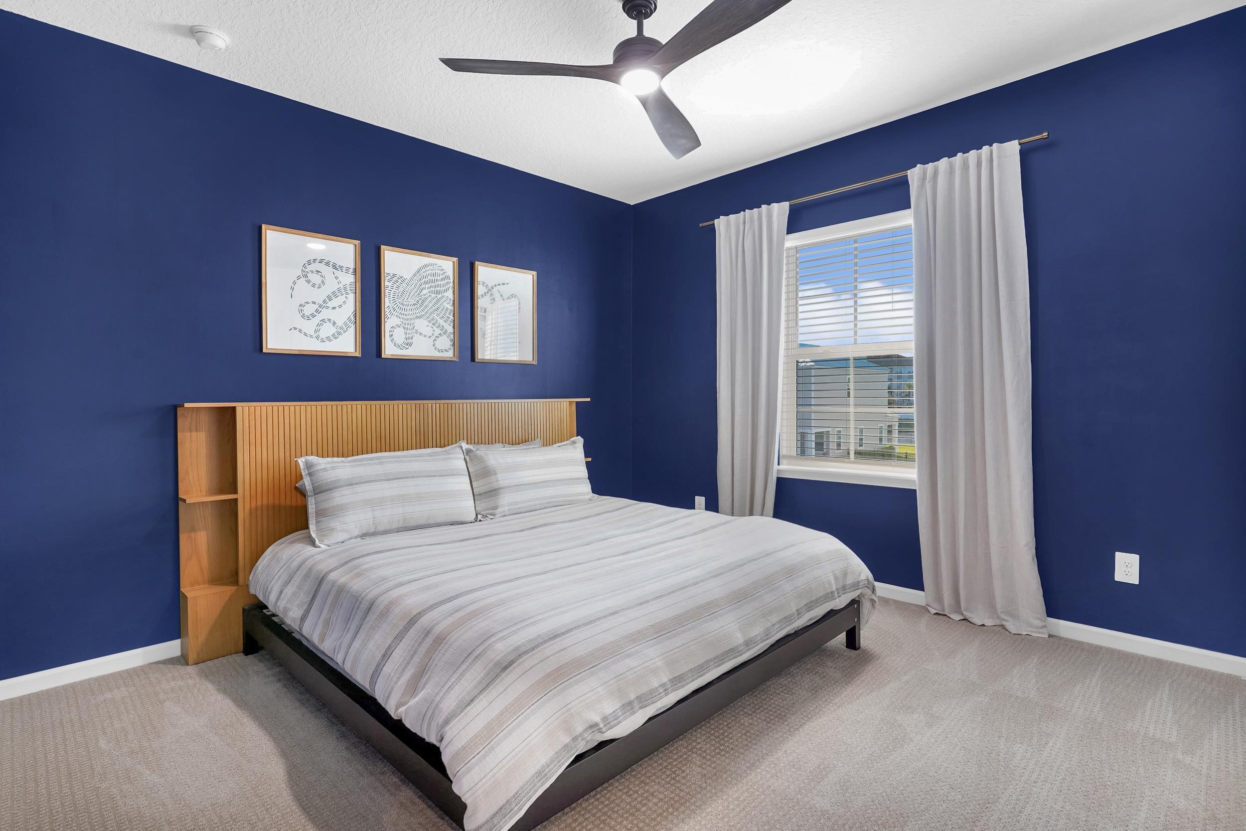 404 Rum Runner Way St. Johns, FL 32259 - Photo 24 of 41 a bedroom with a large bed and a window