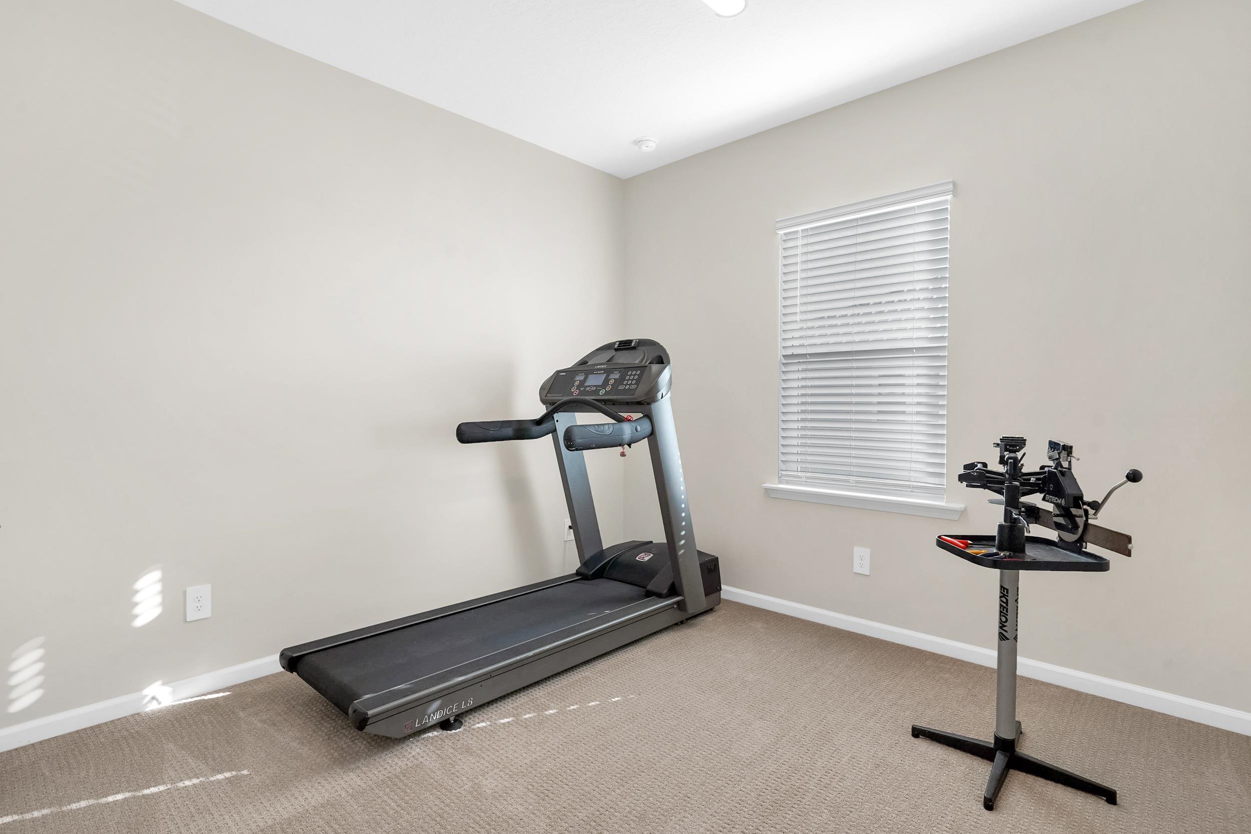404 Rum Runner Way St. Johns, FL 32259 - Photo 25 of 41 a room with gym equipment and windows