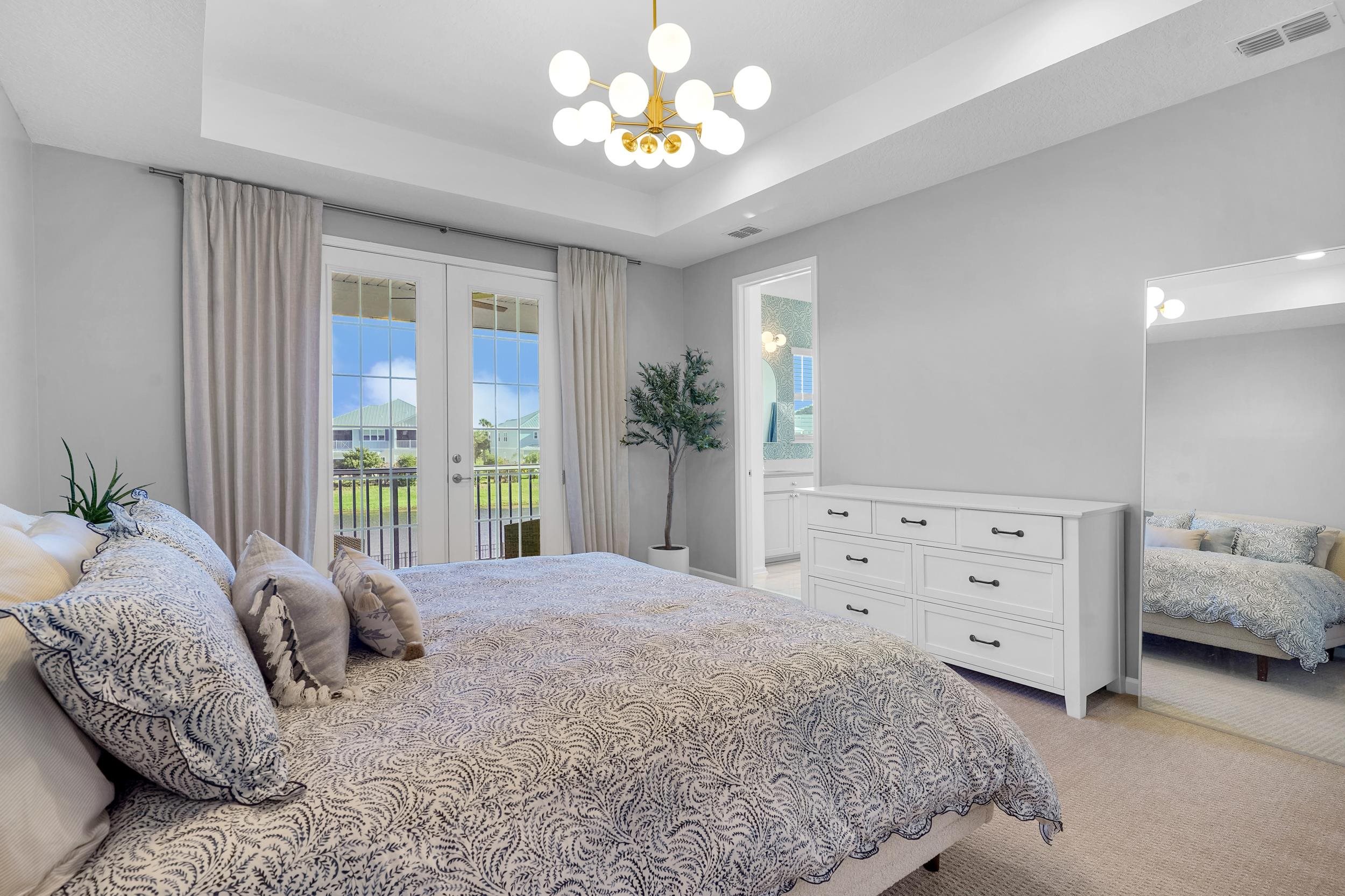 404 Rum Runner Way St. Johns, FL 32259 - Photo 28 of 41 a spacious bedroom with a bed and a window