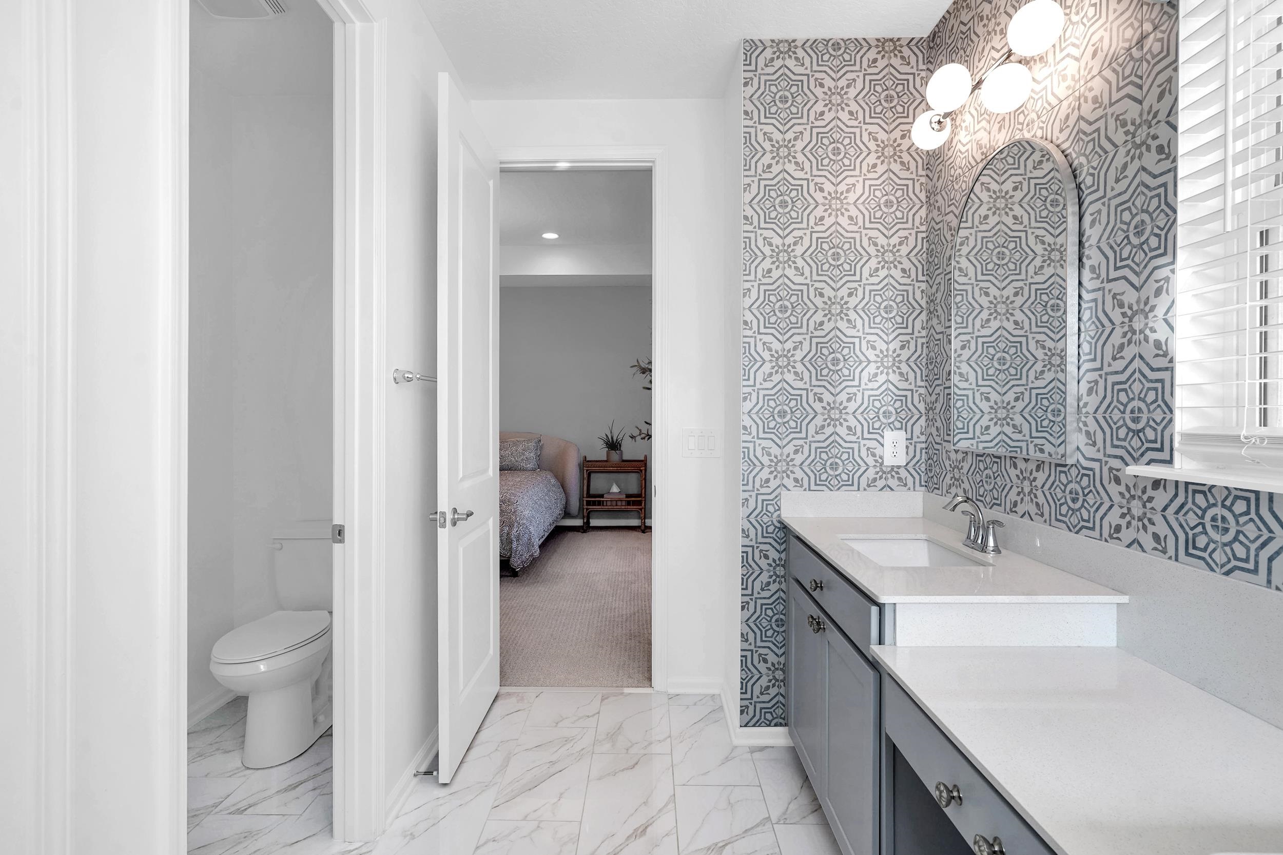 404 Rum Runner Way St. Johns, FL 32259 - Photo 31 of 41 a spacious bathroom with a sink toilet and shower
