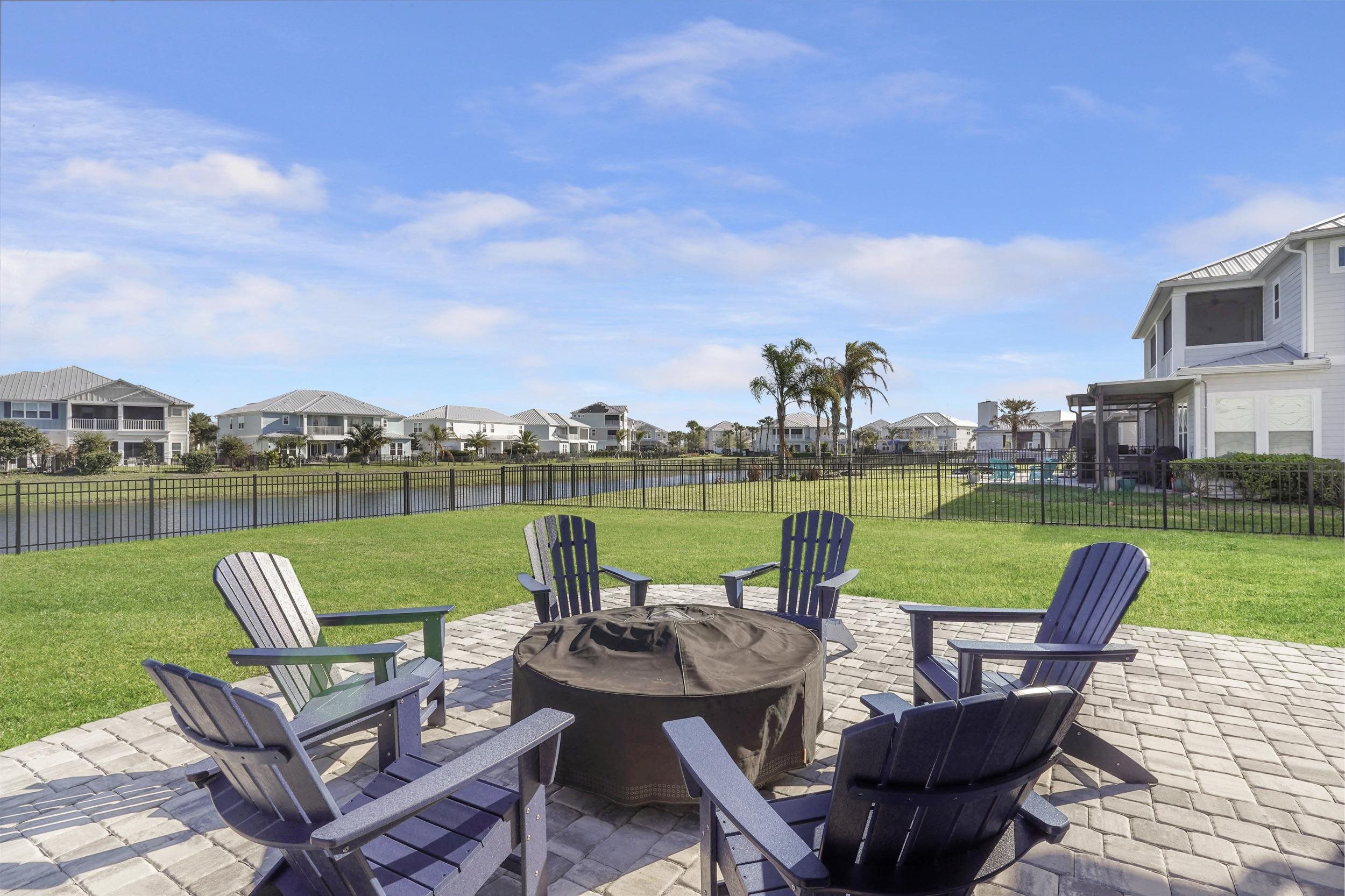 404 Rum Runner Way St. Johns, FL 32259 - Photo 37 of 41 a view of a patio with couches chairs and a yard