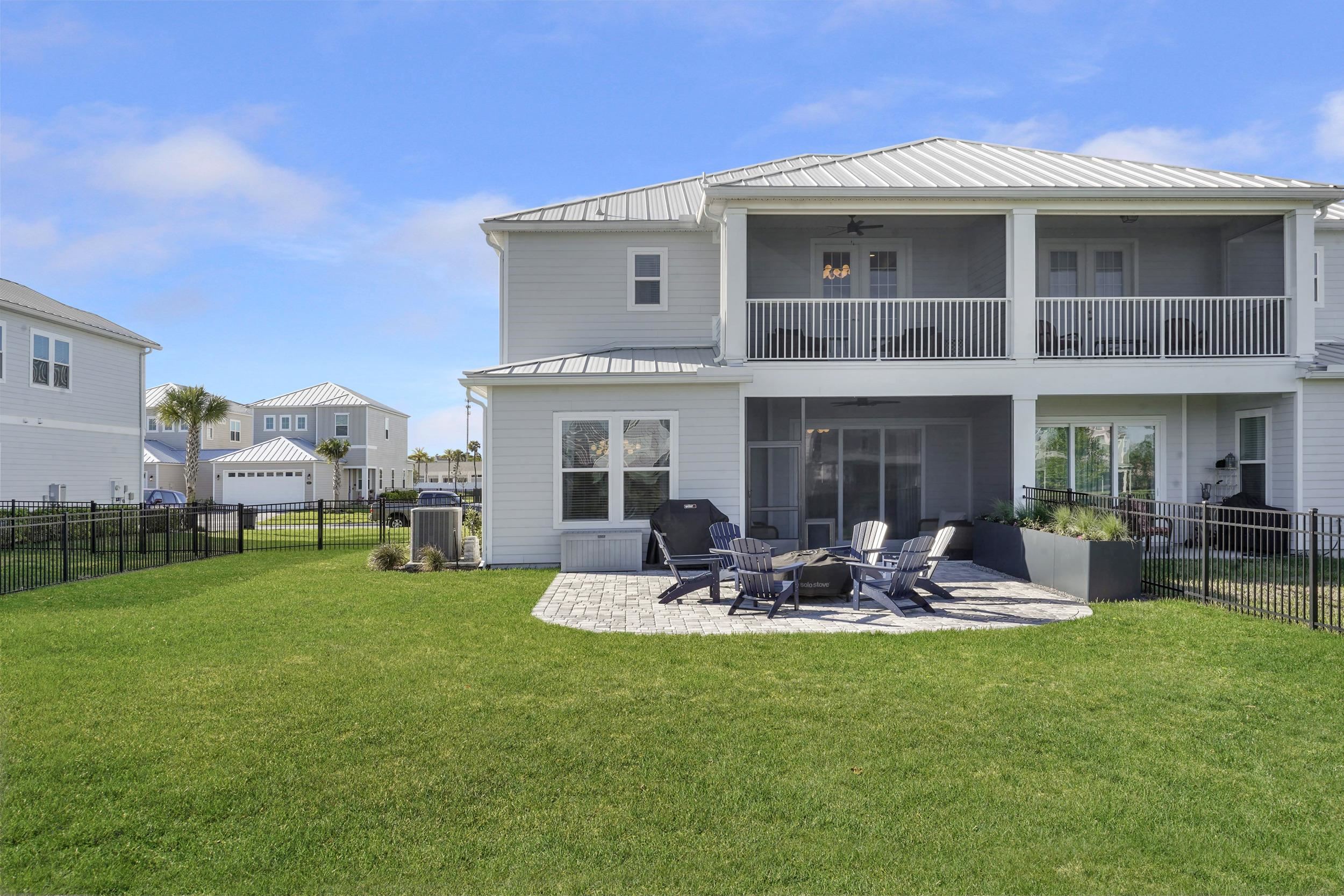 404 Rum Runner Way St. Johns, FL 32259 - Photo 39 of 41 a front view of a house with garden and sitting area