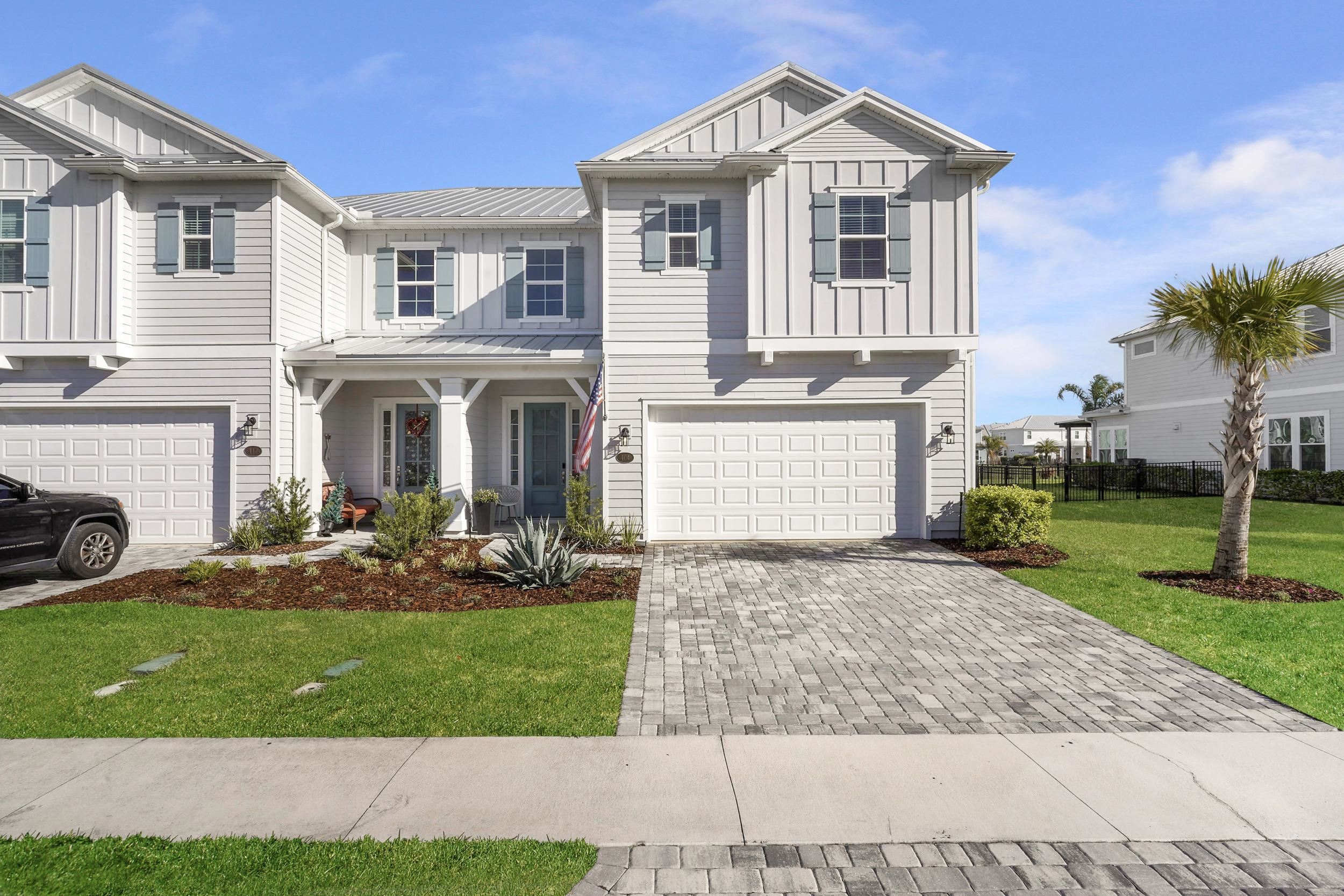 404 Rum Runner Way St. Johns, FL 32259 - Photo 40 of 41 a front view of a house with a yard and porch