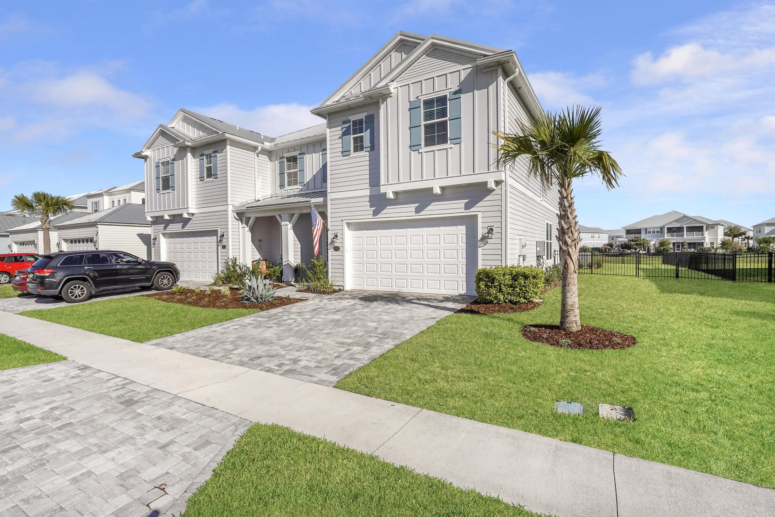 404 Rum Runner Way St. Johns, FL 32259 - Photo 41 of 41 a front view of a house with a yard and garage