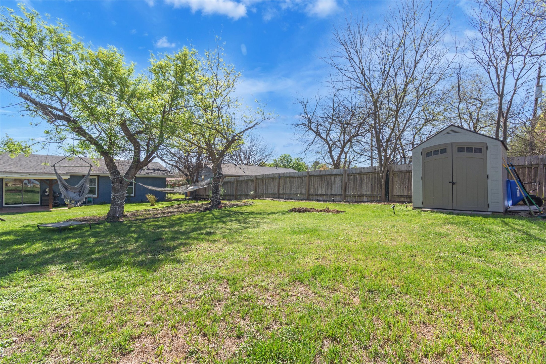 8800 Redfield Lane Austin, TX 78758 - Photo 23 of 27 Storage shed provides additional outdoor storage.