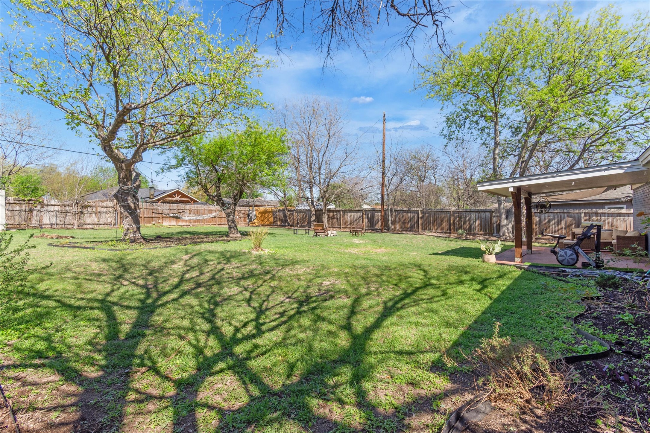 8800 Redfield Lane Austin, TX 78758 - Photo 24 of 27 Large fenced backyard offering endless possibilities.