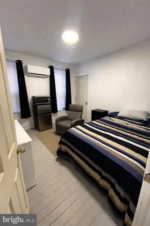 a bedroom with furniture and window