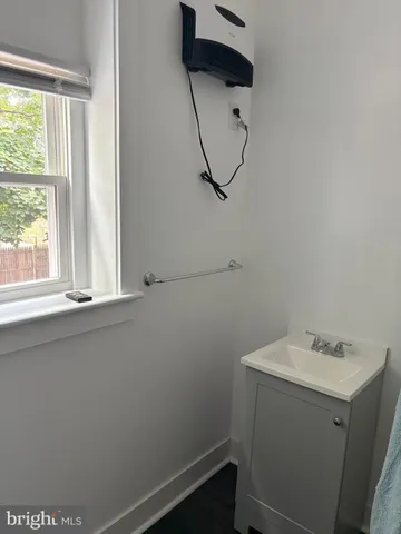 a bathroom with a sink and window