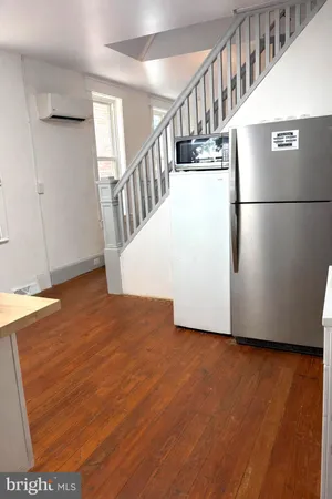 a view of entryway with wooden floor