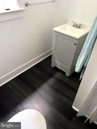 a bathroom with a sink toilet and vanity