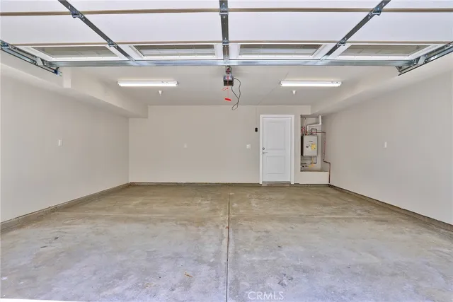 an outdoor space with patio and white umbrellas