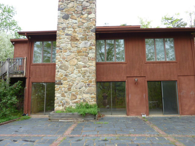 2154 Burkette Road Elliston, VA 24087 - Photo 2 of 6 a front view of a house with a garden