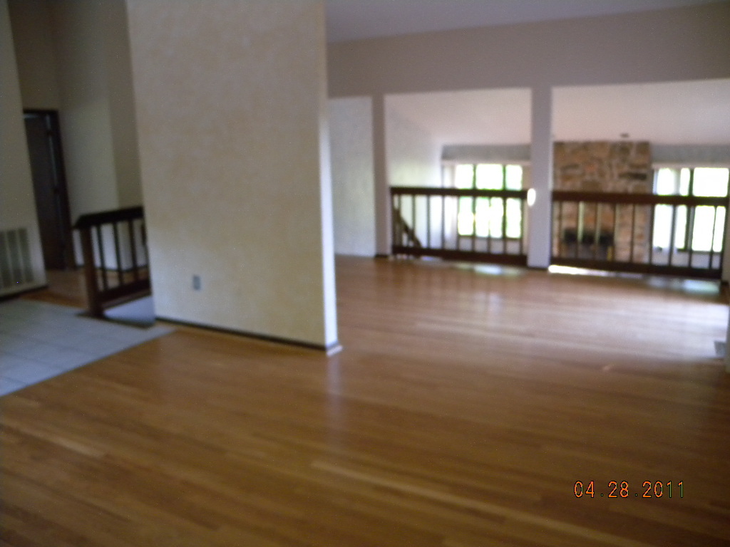 2154 Burkette Road Elliston, VA 24087 - Photo 3 of 6 an empty room with wooden floor and windows