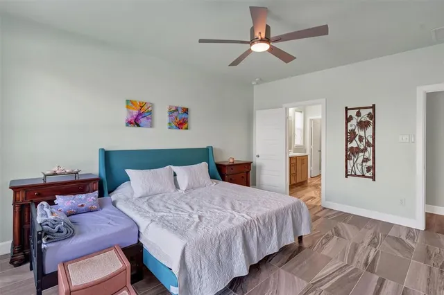 a bedroom with a bed and a dresser