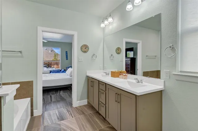 a bathroom with a bathtub and a shower