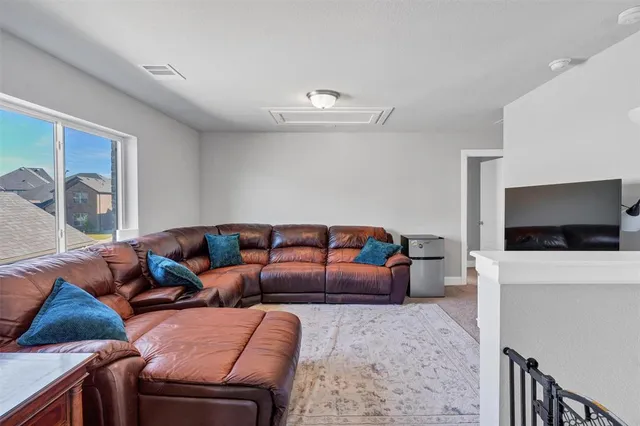 a living room with furniture and a rug